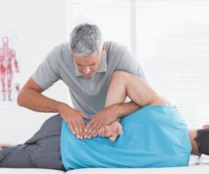 Physical therapist providing spine therapy